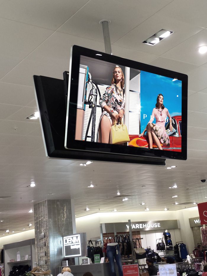 Slimline Pro Digital Advertising Display screen hanged back to back - Be Quantum